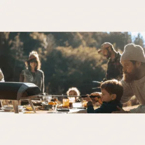 Ooni Koda 12 Camping trip cooking moments with outdoor gas pizza oven. For sale from The Outdoor Scene, Dublin