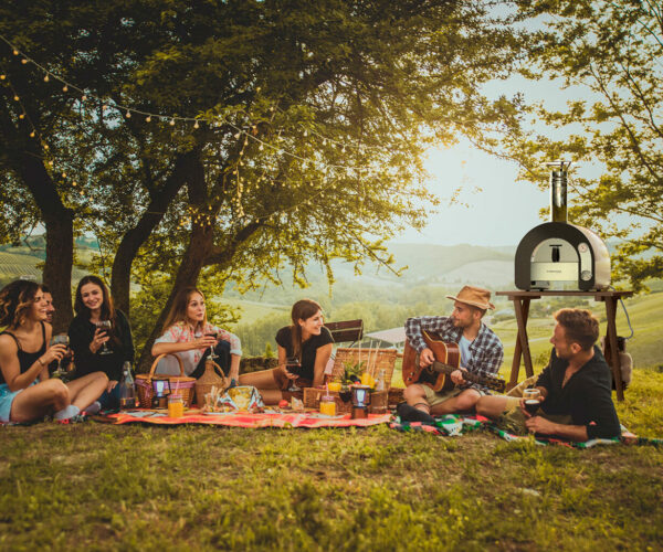 Group of friends eating in the nature