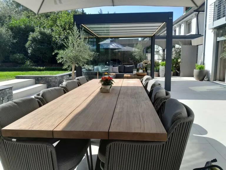 Los marcos Teak garden Dining set with 8 bernini chairs in patio near pergola