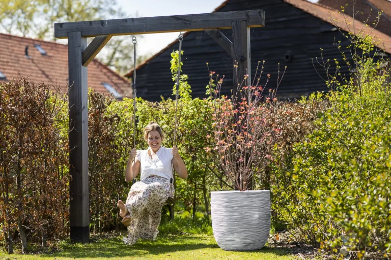 Capi Natural Ivory Coloured Pots in a serene patio - Outdoor Lifestyle Garden Pots and Planters