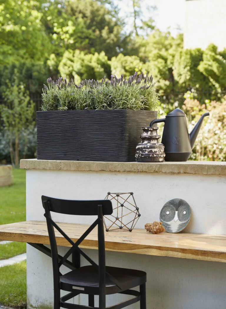 Capi Planter Rectangular Rib Black in a Natural Lifestyle Setting