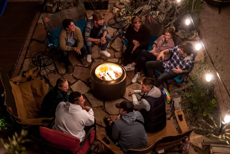 Solo Stove outdoor scene Yukon firepit, smokeless firepit for sale in Dublin Ireland, Patio wood fire lifestyle. lifestyle firepit top view