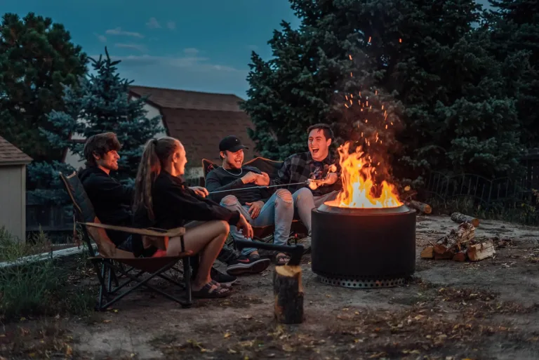 Solo Stove outdoor scene Yukon firepit, smokeless firepit for sale in Dublin Ireland, Patio wood fire lifestyle evening patio and outdoor fire