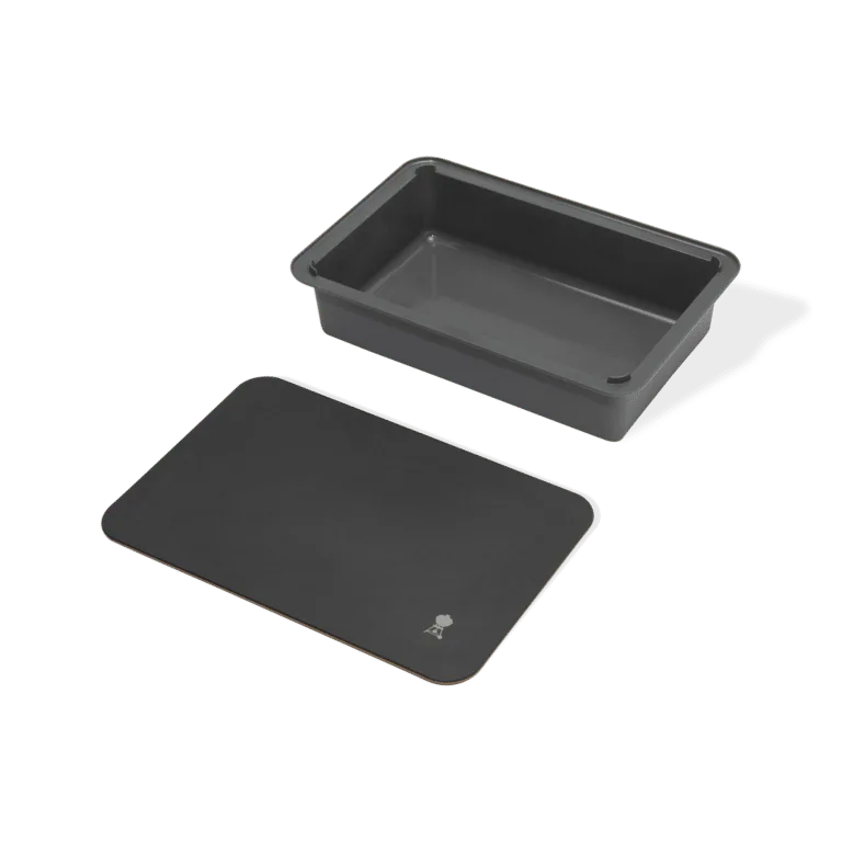 Weber Basin with cutting board for weber gas grills in lifestyle setting on a weber BBQ side shelf. real life cooking skewers.