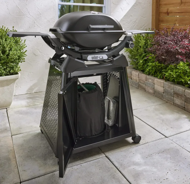 Weber backyard Gas BBQ Ireland lifestyle Q2200 N with side table and permanent cart for sale from The Outdoor Scene