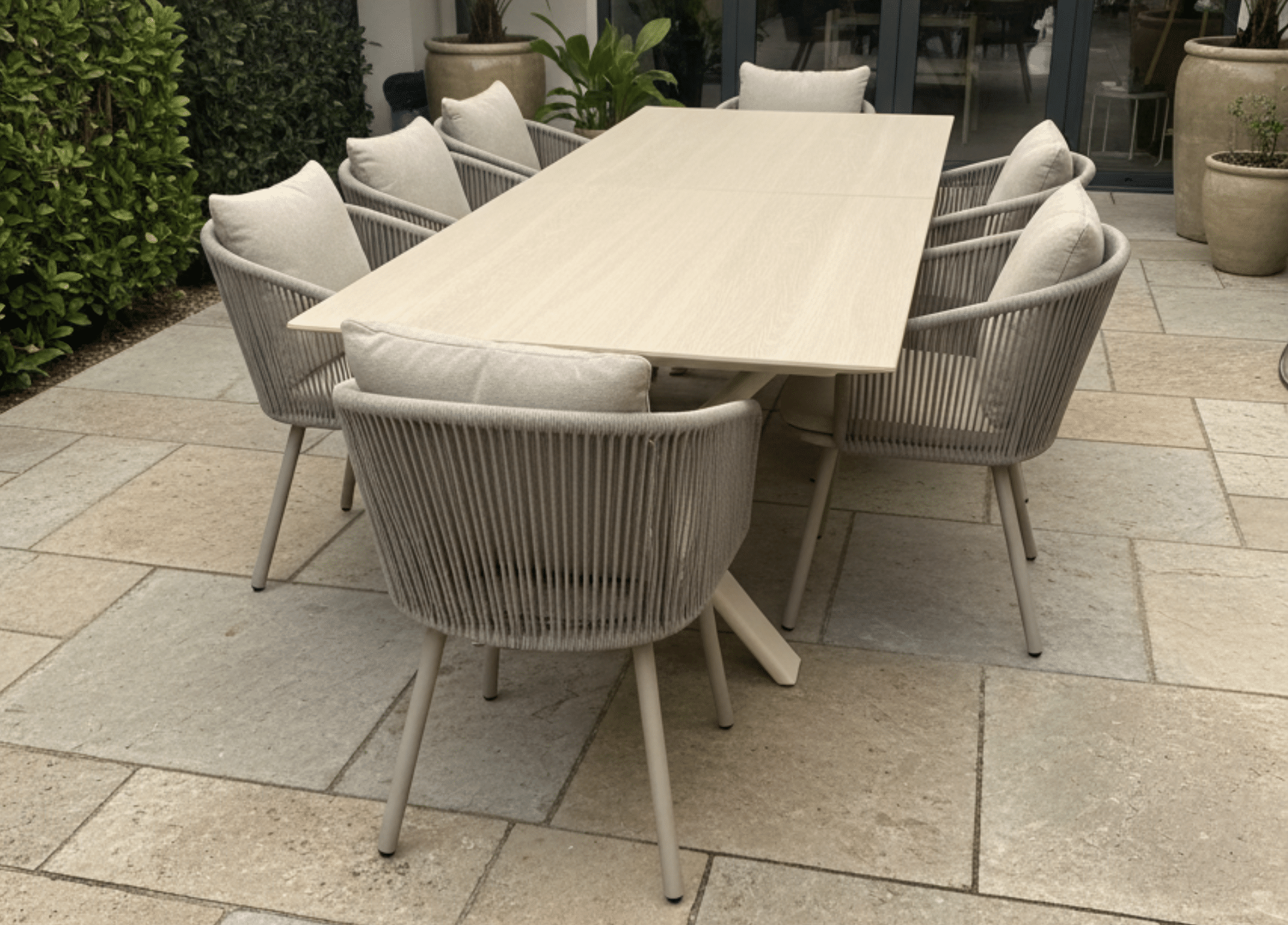 Albatros Extendable Dining Table for sale from The outdoor scene, Dublin 14,. 6 seater sand stone top with 6 X harbour Chairs