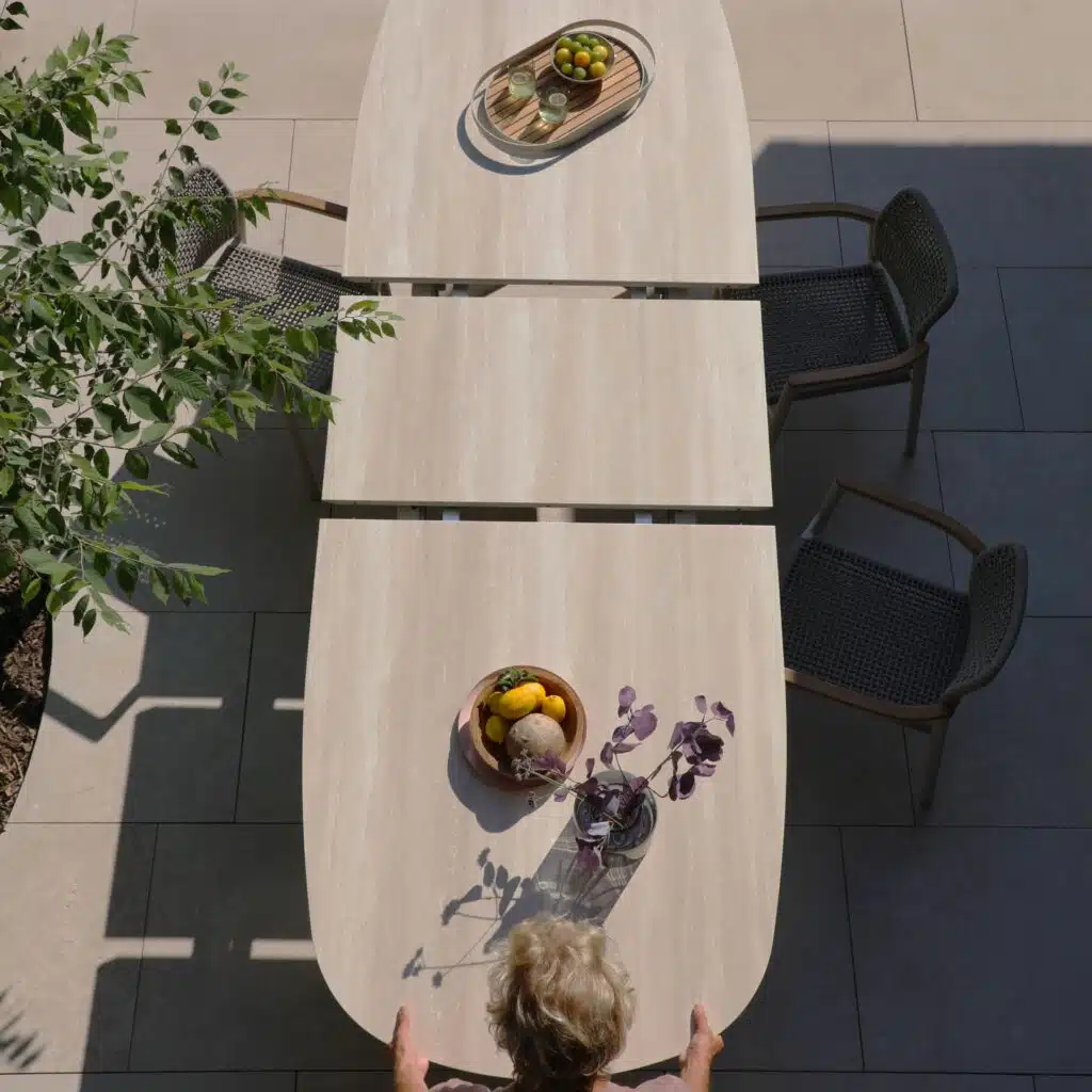 Albatros Organic 250 -310cm extendable Dining table in Bob Sand colour for sale from the Outdoor Scene, Dublin, Ireland. Lifestyle