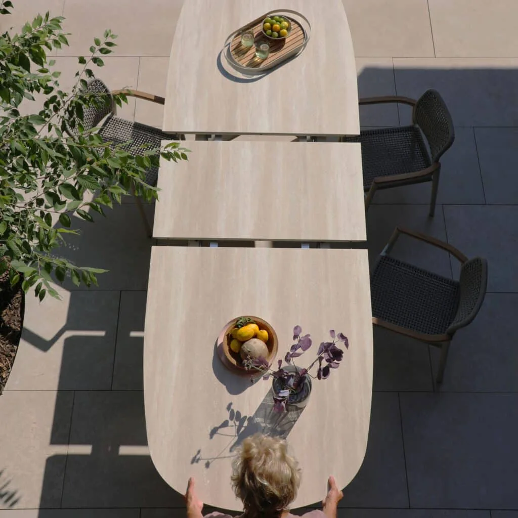 Albatros Organic 250 -310cm extendable Dining table in Bob Sand colour for sale from the Outdoor Scene, Dublin, Ireland. Lifestyle