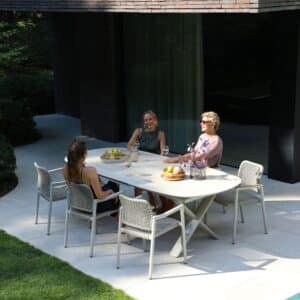 Albatros Organic 250 -310cm extendable Dining table in Bob Sand colour for sale from the Outdoor Scene, Dublin, Ireland. Lifestyle garden dining