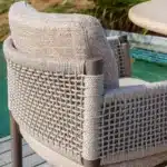 Savanne arm-chair on weave back lifestyle picture. 2026 Furniture Garden furniture collection from The Outdoor Scene.
