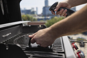 Weber BBQ spirit E 325 gas barbecue for sale in Ireland. Shop from The Outdoor Scene, Dublin. Cleaning griddle