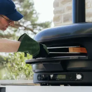 Gozney Heat Resistant Gloves while cooking with a pizza oven