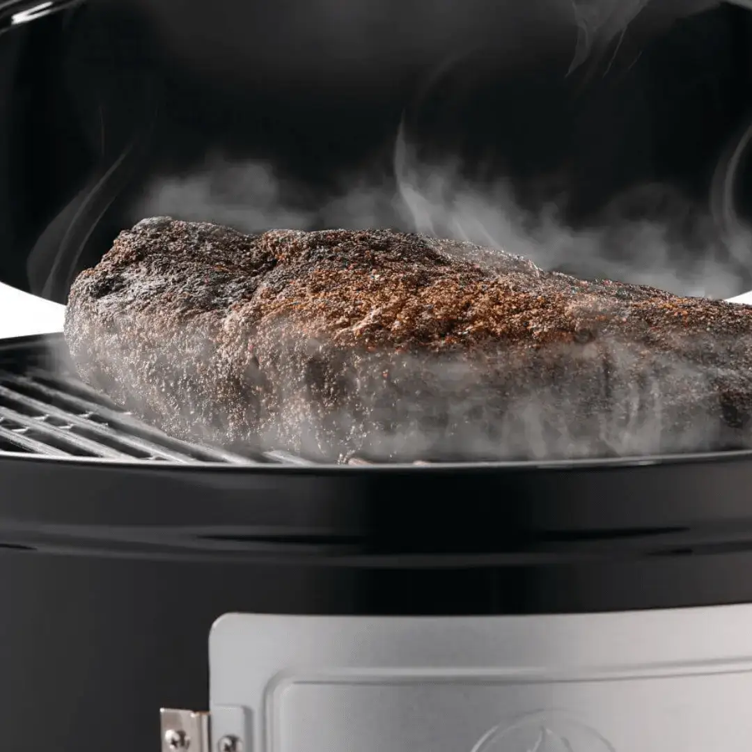 Meat cooking on Napoleon Apollo 22 Charcoal Smoker