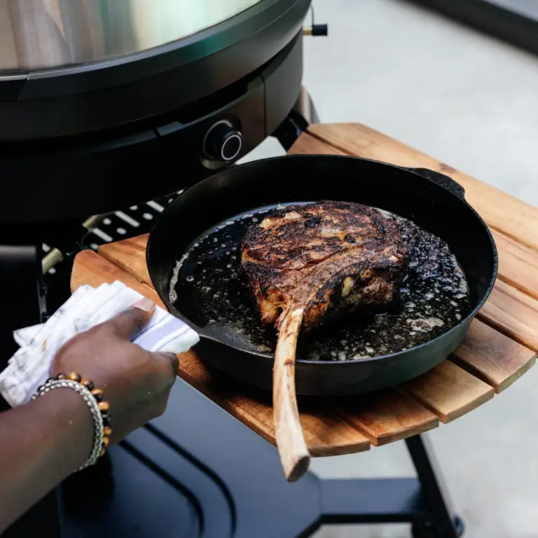 Outdoor pizza oven stand with adjustable prep shelves.