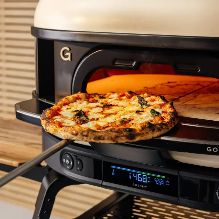 Fresh Neapolitan pizza baking inside a Dome (Gen 2) oven fitted with the Neapolitan Arch